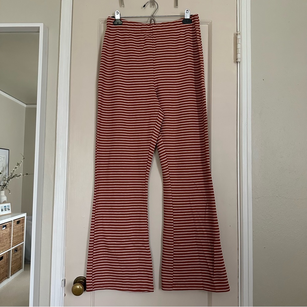 Urban Outfitters orange and white striped flared leggings 🧡🤍